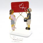 Ζευγάρι με πίνακα σε βότσαλο